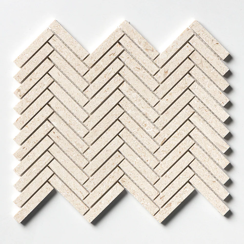 The limestone herringbone straight on, its narrow cream batons showing a finely pitted brushed surface.