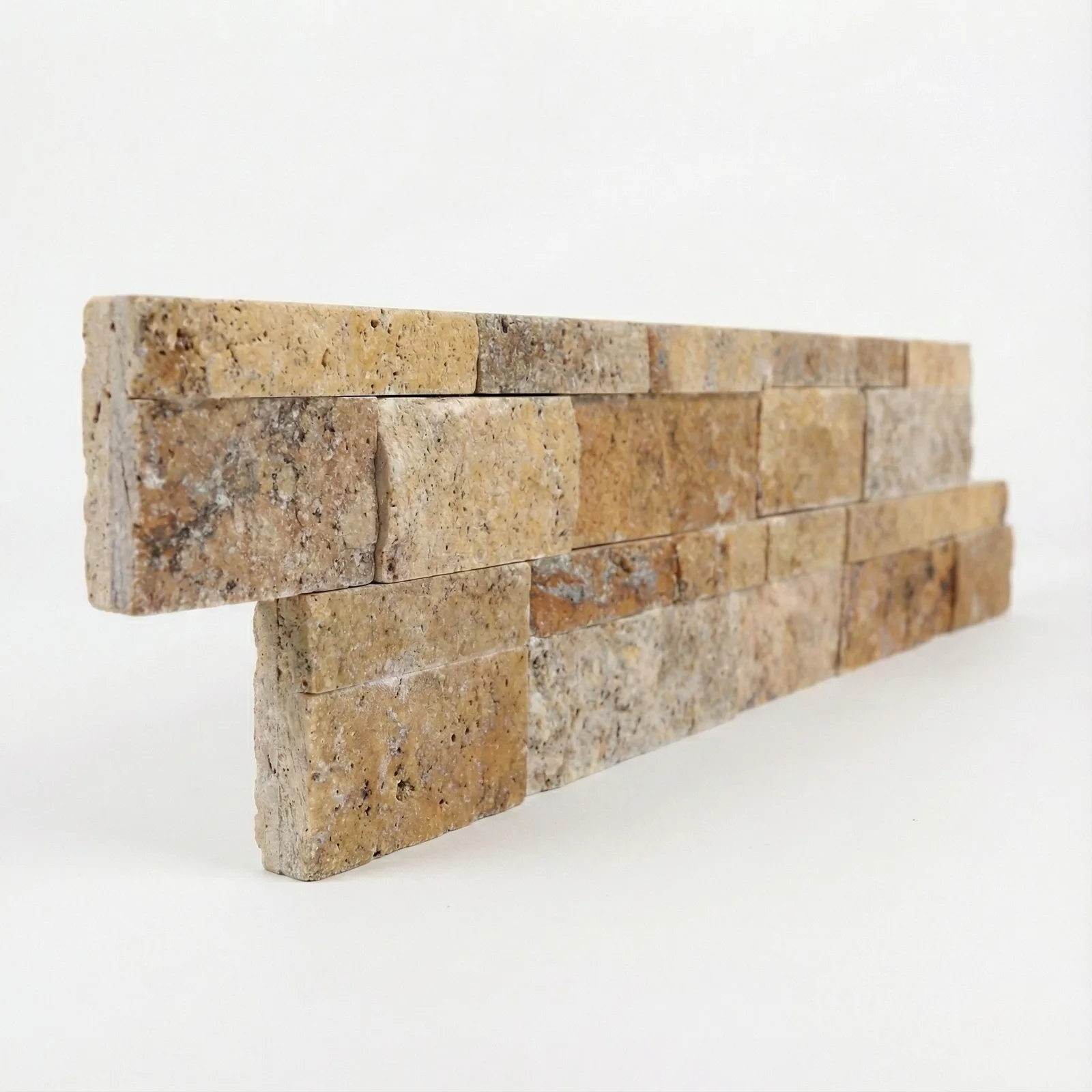 Scabos corner piece seen at an angle, the split faces stepping forward and the grey and rust banding running through the strips.