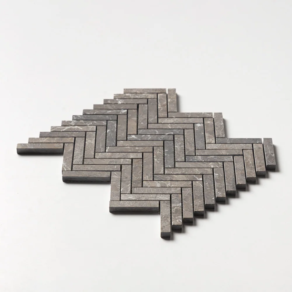 Silver Drop herringbone in slender dark grey-brown batons, the sheet angled low against a white ground.