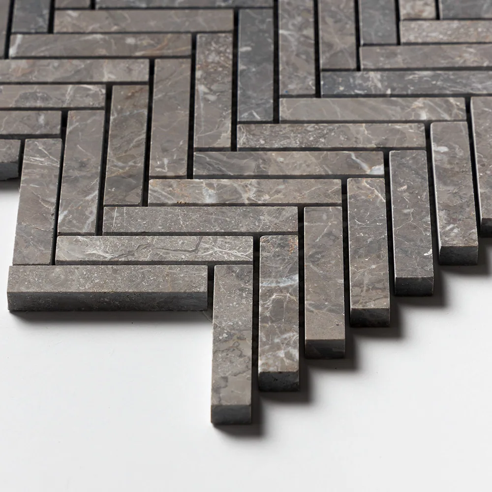 Close detail of the Silver Drop herringbone, the dark stone showing its sawn edges and the depth of each baton.